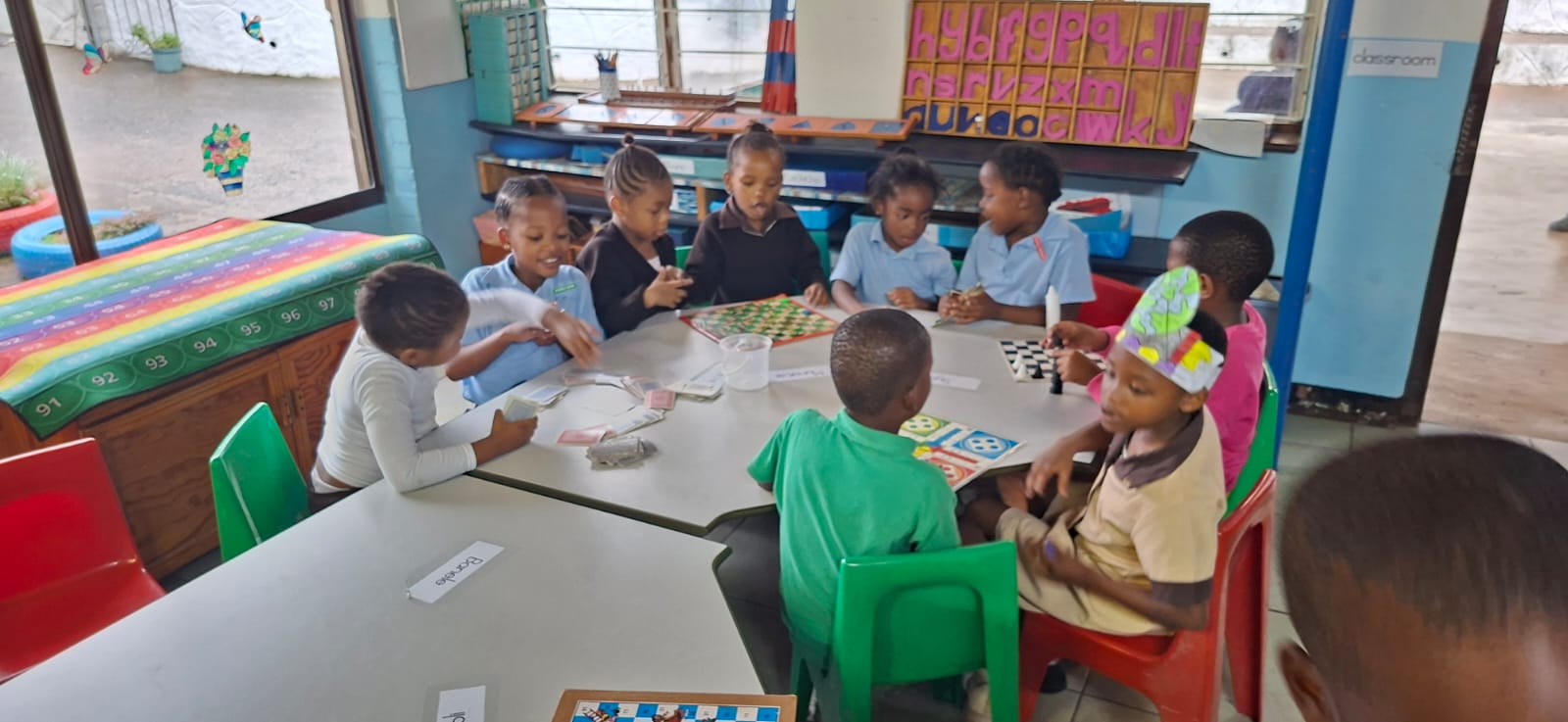 School-age children enjoying board games together at aftercare