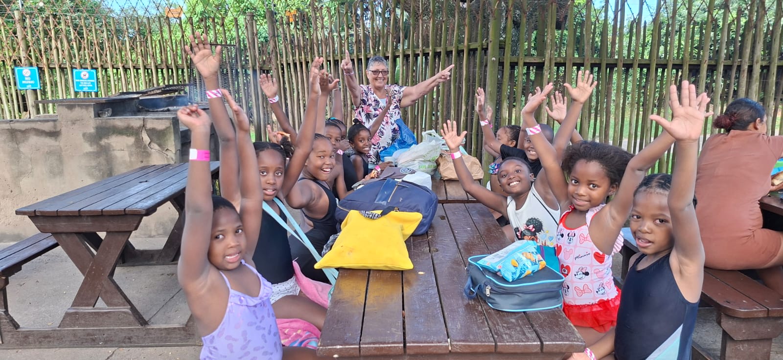 Children enjoying a picnic together during a holiday outing
